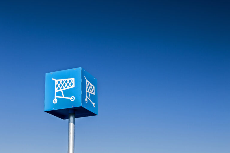 Sign indicating a spot on a parking lot designated for shopping carts.